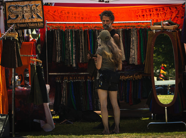 stumptown kilts vending booth with a customer and vendor Todd