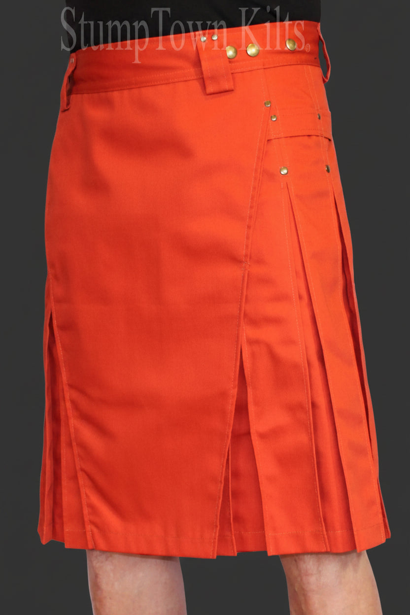 men's orange kilt with antique brass snaps and rivets