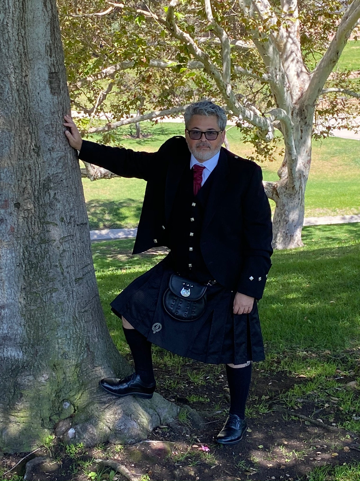 Male model in Pinstripe Kilt formally dressed with jacket, vest, and tie