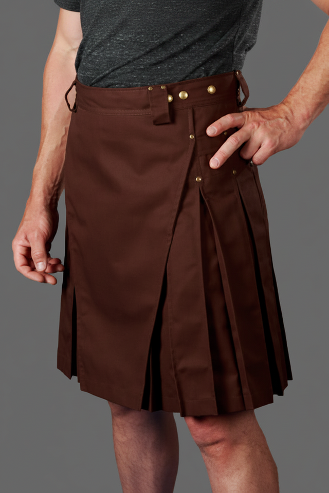 Brown kilt worn by a person on a gray background