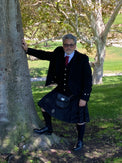 Male model in Pinstripe Kilt formally dressed with jacket, vest, and tie 