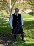 Pinstripe Kilt worn by a male model outside 